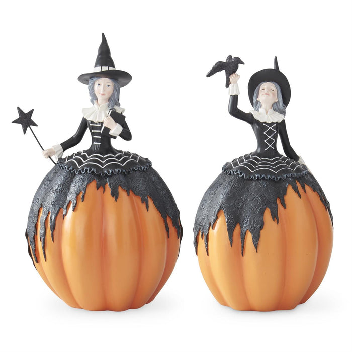 Set of two orange and black resin pumpkin witch figurines with crow