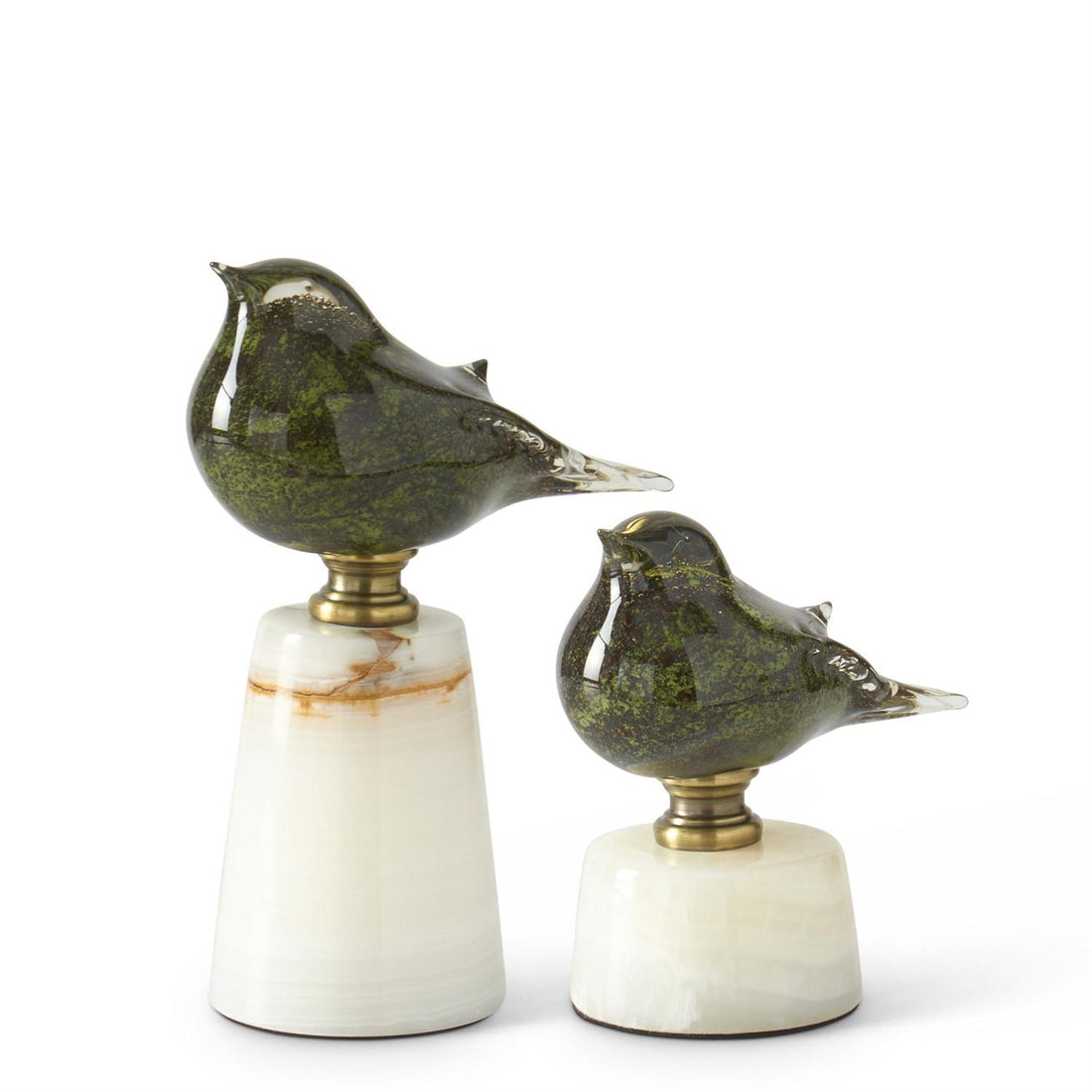 Set of two green glass bird figurines on white marble bases