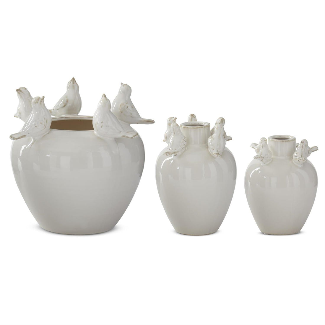 Set of three cream ceramic bird rim vases in graduated sizes