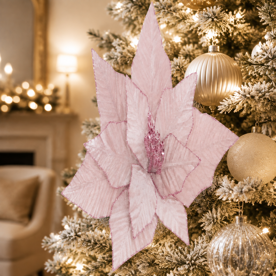 Blush pink velvet poinsettia pick styled in an elegant ivory-and-gold Christmas tree