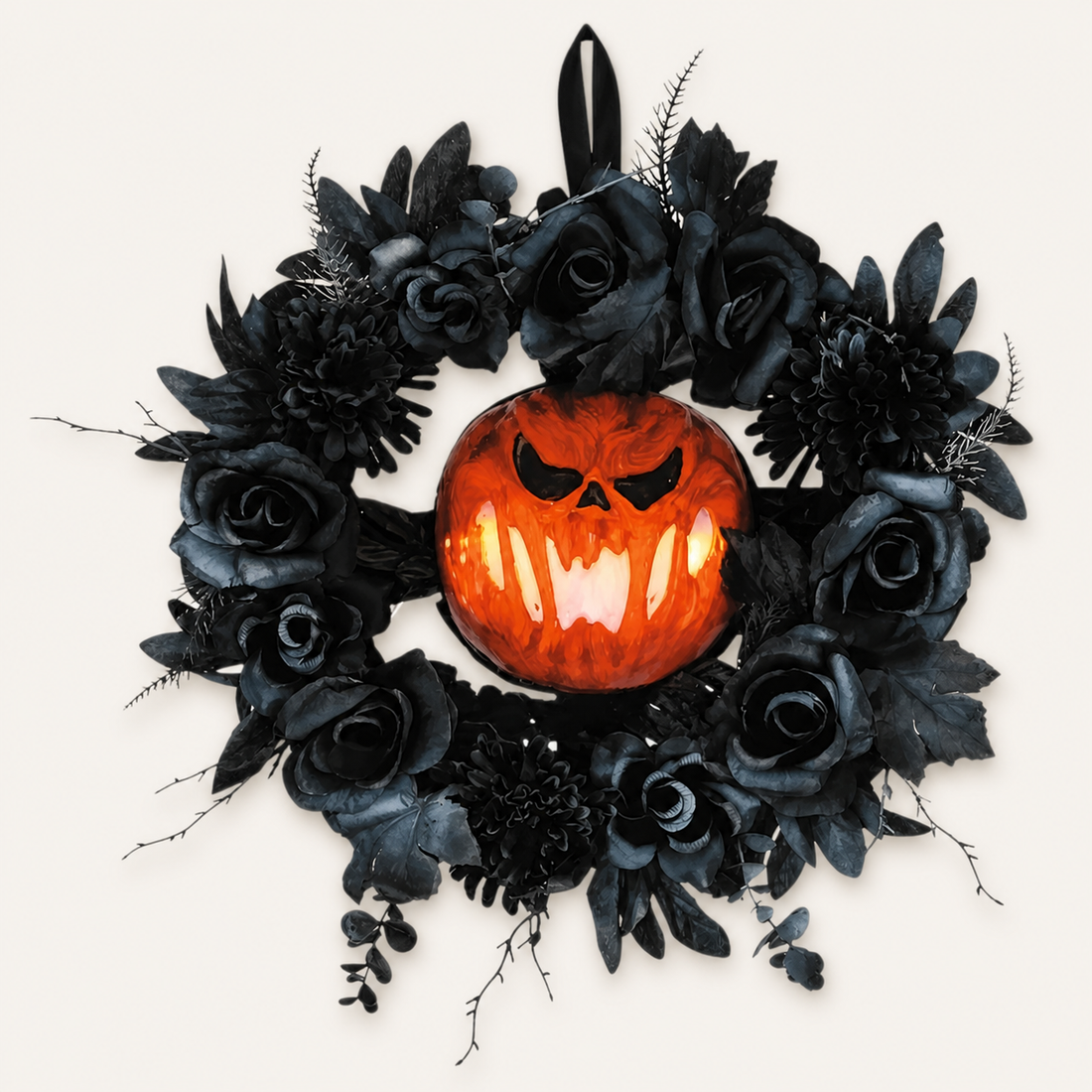 Black floral Halloween wreath with glowing LED jack-o'-lantern on a warm neutral background