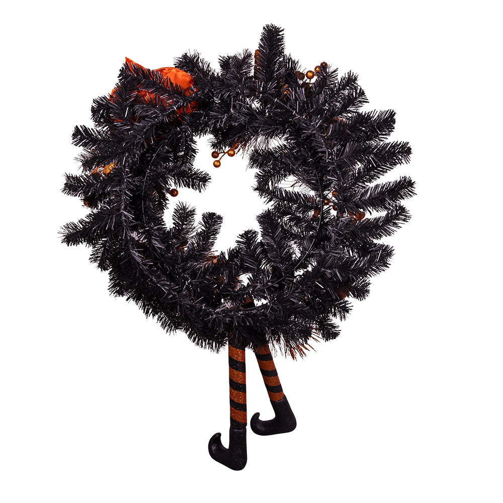 Black Halloween wreath with witch hat and striped leg decorations