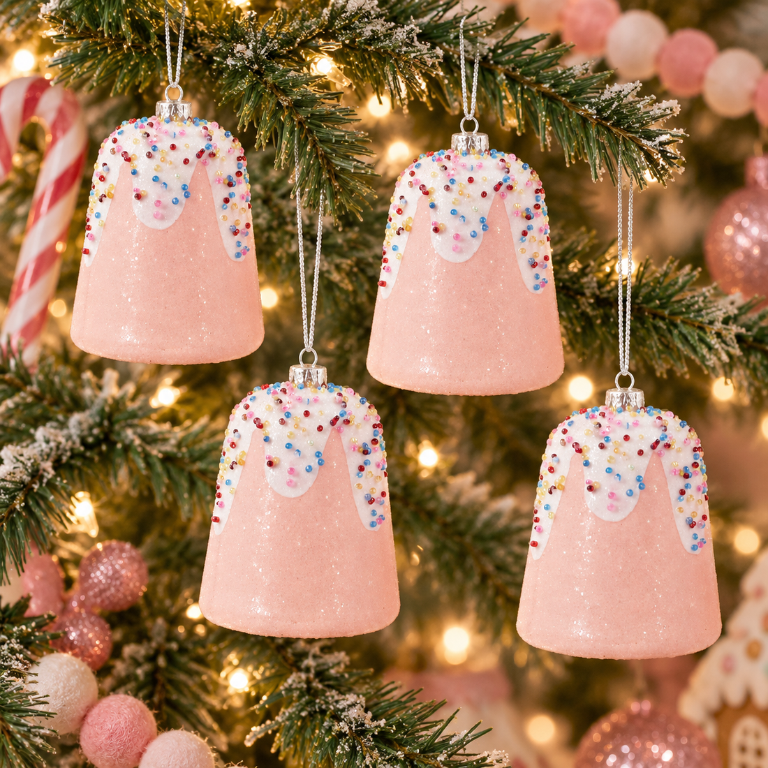 AI styling inspiration showing four pink gumdrop ornaments hanging on a Christmas tree