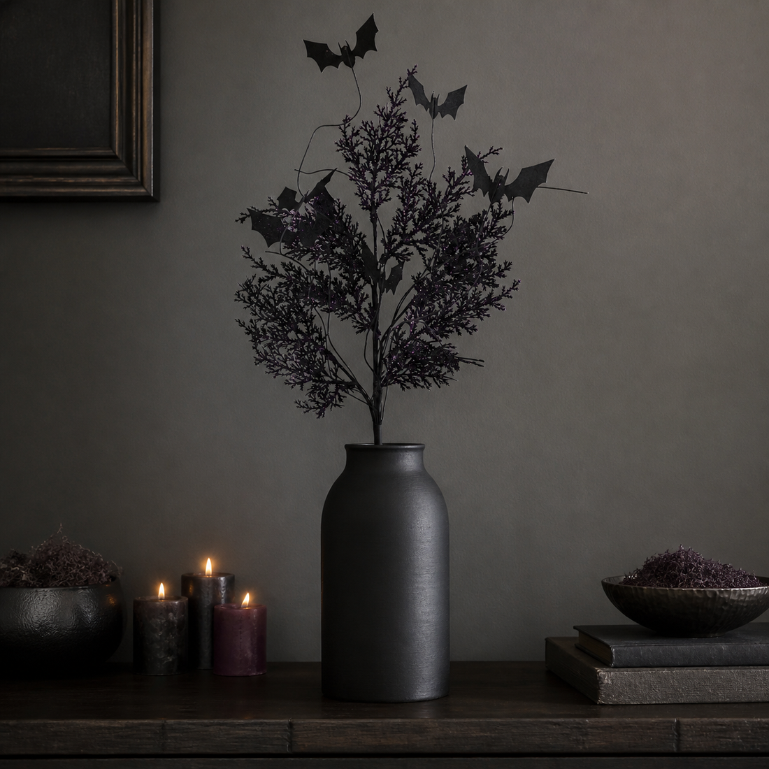 Black and purple glitter bat Halloween floral spray arranged in a matte black vase