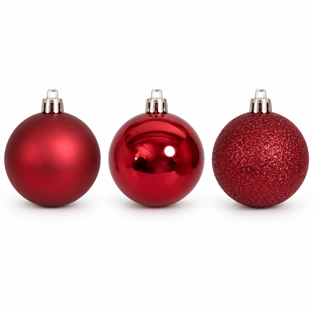 AI-enhanced Oxblood ornament finish detail on white background; three representative ornaments shown, set includes 50